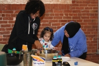 two EHS staff with child